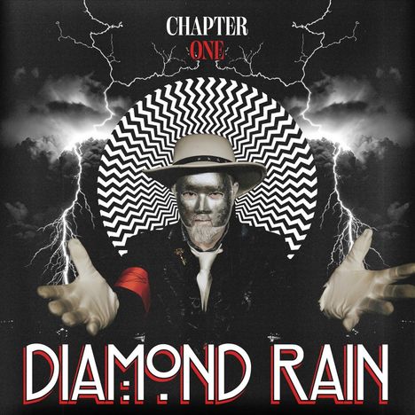 "CHAPTER ONE" oben, "DIAMOND RAIN" unten. Ein Mann mit silberner Maske, Hut und Handschuhen vor Zickzack-Hintergrund und Blitzen.