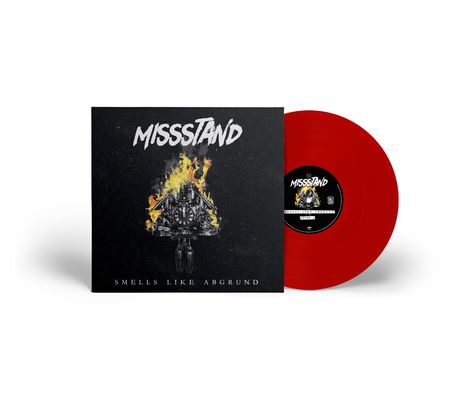Cover mit "MISSTÄND", "SMELLS LIKE ABGRUND"; Uhr im Flammen, rote Vinylplatte daneben.