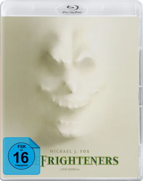 FSK ab 16 freigegeben. Michael J. Fox. The Frighteners. A Peter Jackson film. Relief eines grinsenden Gesichts im Hintergrund.