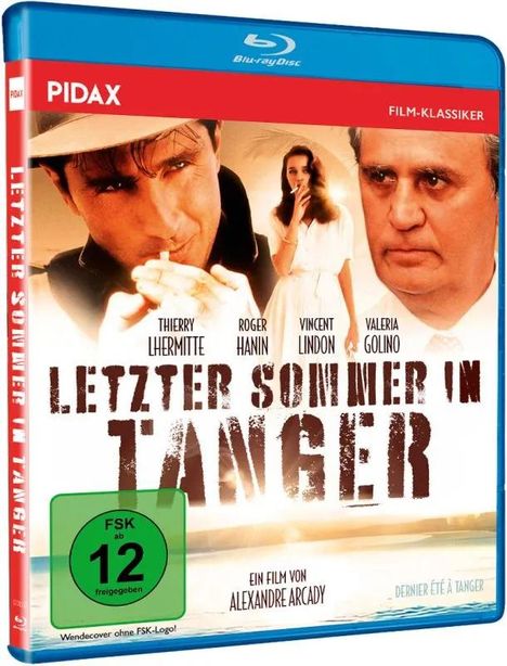 LETZTER SOMMER IN TANGER. FSK ab 12. Ein Film von Alexandre Arcady. Drei Personen im Vordergrund, zwei Männer, eine Frau.