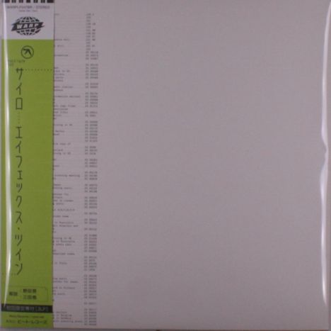 Ein grüner Streifen mit vertikalem Text in Japanisch. Links oben ein Logo mit "WARP". Links von Trackliste etwas zu sehen.