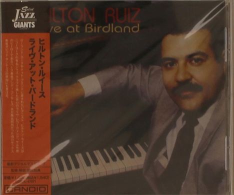 Text: "Milton Ruiz Live at Birdland" und japanische Schriftzeichen seitlich. Ein Mann in Anzug posiert mit einem Klavier.