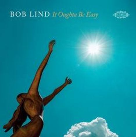 "Bob Lind It Oughta Be Easy". Skulptur einer Figur mit ausgestreckten Armen unter strahlender Sonne und blauem Himmel.