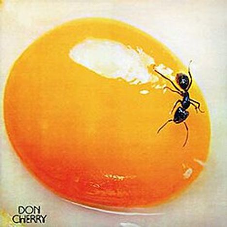 Unten links steht "Don Cherry". Eine Ameise läuft auf einem großen, orangefarbenen Tropfen.