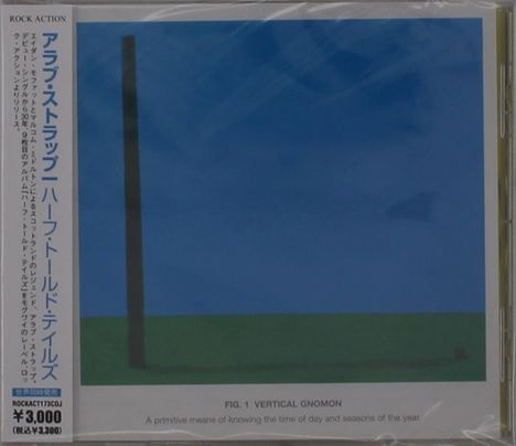 Links japanischer Text. Darunter: ¥3,000. Rechts unten: FIG. 1 VERTICAL GNOMON. Illustration mit blauem Himmel, grünem Boden.