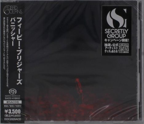CD-Hülle mit japanischen Schriftzeichen, Preisangabe und "SECRETLY GROUP" Logo. Dunkle, abstrakte Kunst auf der Vorderseite.