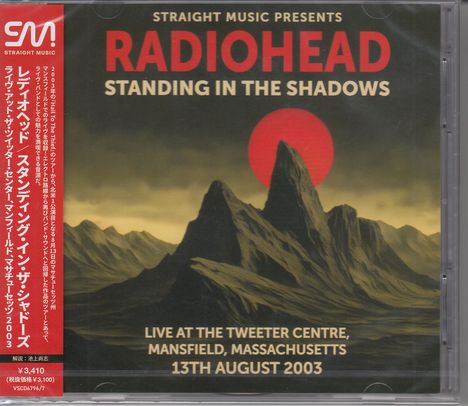 "Straight Music Presents Radiohead Standing in the Shadows", Bergsilhouette vor rotem Mond. Links vertikaler Text-Block.