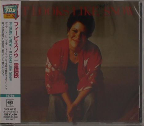 Text: "IT LOOKS LIKE SNOW", "PHOEBE SNOW". Frau in rotem Kimono lächelt freundlich, sitzt nach vorne gebeugt. Japanische Schrift links.