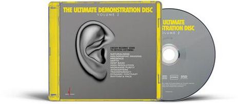 "THE ULTIMATE DEMONSTRATION DISC VOLUME 2" in Gelb. Ohrabbildung, grauer Hintergrund, CD-Hülle und Disc sichtbar.