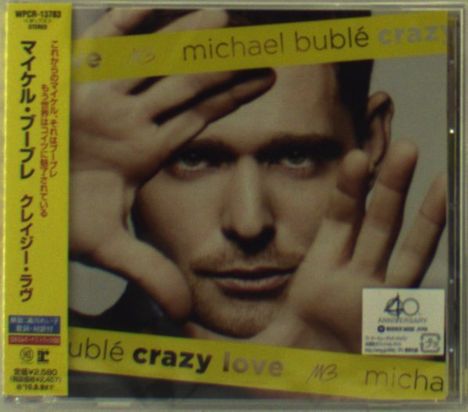 Ein Albumcover mit den Texten "michael bublé crazy love". Ein Mann hält die Hände nach vorne. Japanische Schriftzeichen sind links.