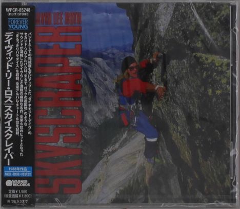 „SKYSCRAPER“ in roter Schrift. Ein Bergsteiger klettert eine steile Felswand hinauf. Japanischer Text links.