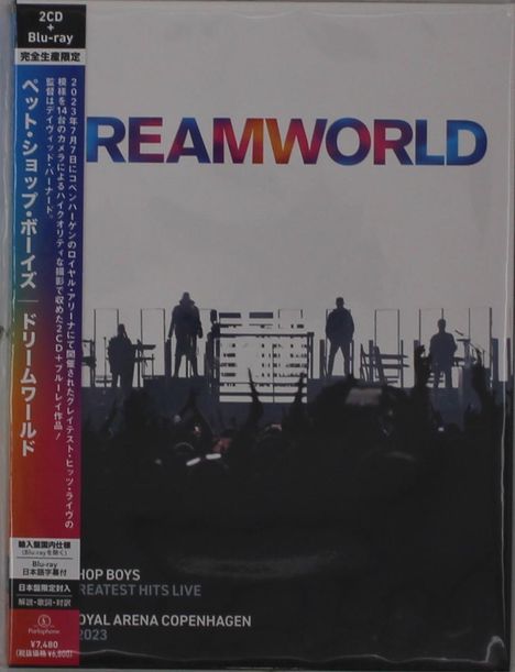 „DREAMWORLD“ in bunten Buchstaben, Menschen auf einer Bühne. Text: „GREATEST HITS LIVE“, „ROYAL ARENA COPENHAGEN 2023“.