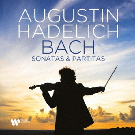AUGUSTIN HADELICH BACH SONATAS & PARTITAS. Silhouette eines Violinisten vor einem dramatischen Sonnenuntergang.