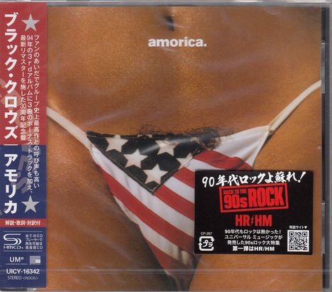 Das Bild zeigt den Text "amorica." und enthält japanische Schriftzeichen. Ein Slip mit US-Flaggenmuster ist sichtbar.
