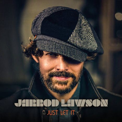 Text: "JARROD LAWSON" und "JUST LET IT". Ein Mann mit Bart trägt eine karierte Schiebermütze und lächelt leicht.