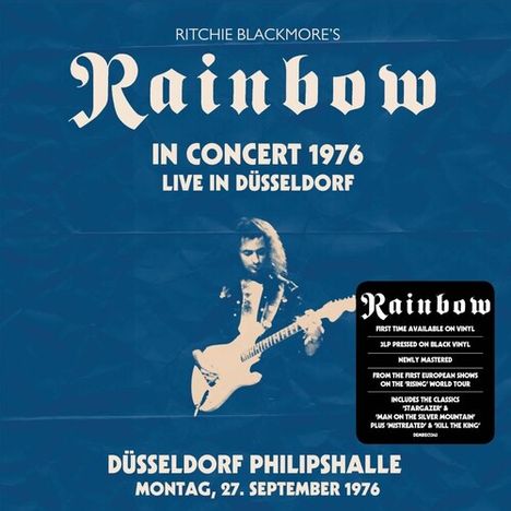 Text: "Ritchie Blackmore's Rainbow. In Concert 1976, Live in Düsseldorf. Düsseldorf Philipshalle, Montag, 27. September 1976." Enthält ein stilisiertes Bild eines Gitarristen.