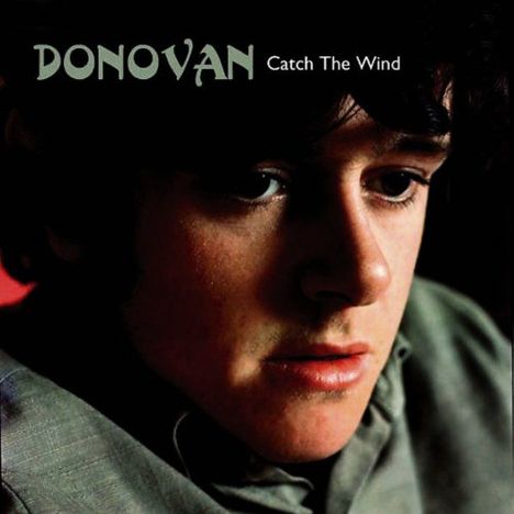 Text: "DONOVAN Catch The Wind". Es zeigt eine nachdenkliche Person in Nahaufnahme mit dunklem Hintergrund.