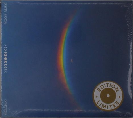 "Moon Music", "Coldplay", "Édition Limitée". Bunte Mondsichel mit Regenbogeneffekt auf dunkelblauem Hintergrund.