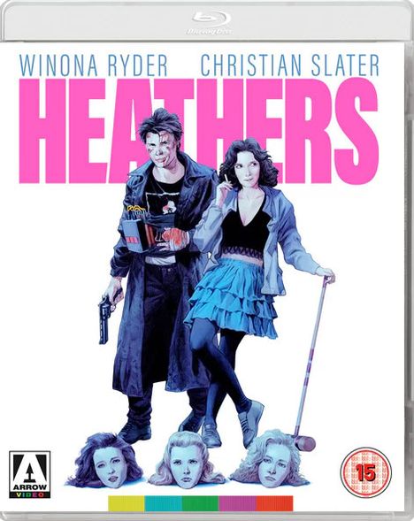 "HEATHERS" in großen pinken Buchstaben, darunter zwei Personen, eine mit einem Gewehr, die andere in blauer Kleidung.