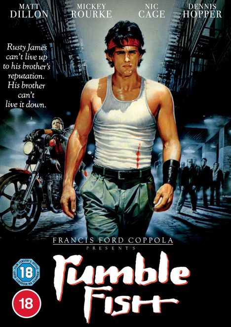 Filmplakat "Rumble Fish", zeigt muskulösen Mann in weißem Shirt und roten Stirnband, darunter Titel und Namen von Schauspielern.