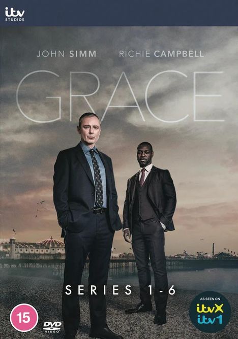 "GRACE - JOHN SIMM - RICHIE CAMPBELL - SERIES 1-6" mit zwei Männern in Anzügen vor einer Strandpromenade.