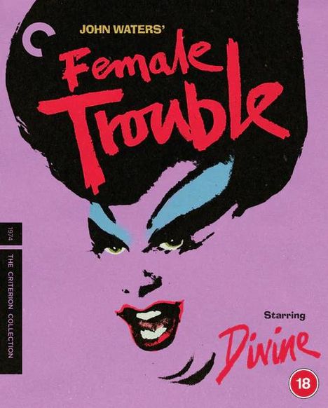 Text: "John Waters' Female Trouble. Starring Divine. 18." Illustration: Gesicht mit dramatischem Make-up auf lila Hintergrund.