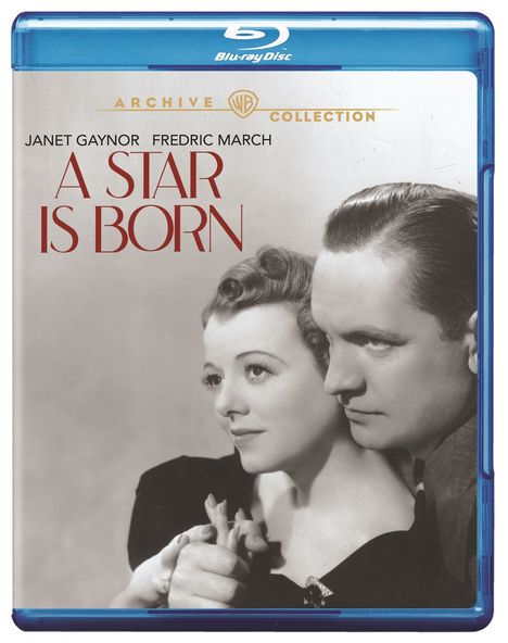 Text: "A STAR IS BORN", "JANET GAYNOR", "FREDRIC MARCH", "ARCHIVE COLLECTION". Schwarz-Weiß-Foto eines Paares.