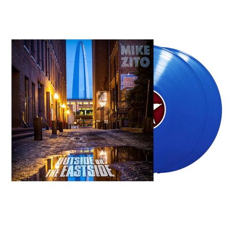 Texte: "MIKE ZITO", "OUTSIDE OF THE EASTSIDE". Stadtansicht mit beleuchteter Gasse, blauer Bogen im Hintergrund und zwei blaue Schallplatten.