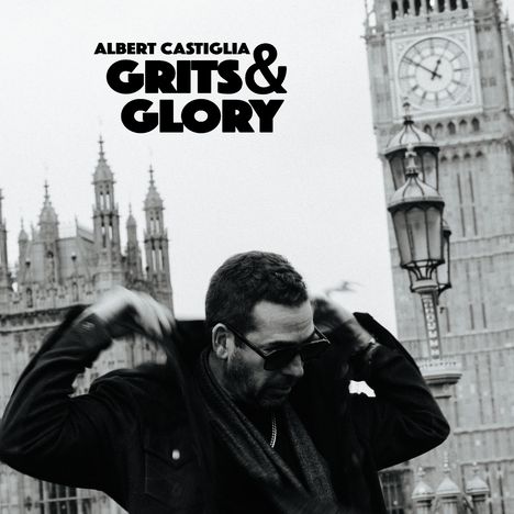 Texte: "ALBERT CASTIGLIA GRITS & GLORY". Mann mit Sonnenbrille vor dem Londoner Big Ben und einem gotischen Gebäude.