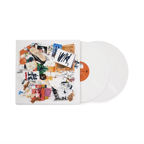 Cover mit Collage aus Zeitungsausschnitten, Fotos und Grafiken, darunter groß "WIKI". Zwei weiße Schallplatten dahinter.