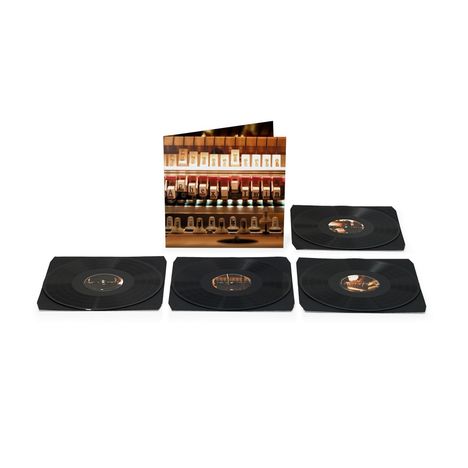 Titelseite mit "Aphex Twin". Vier schwarze Vinyl-Schallplatten sind ausgelegt.