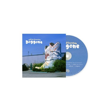 Text: "Jeffrey Silverstein Doggone." CD-Hülle mit riesigem Cowboy-Stiefel vor einem Gebäude, CD rechts daneben.