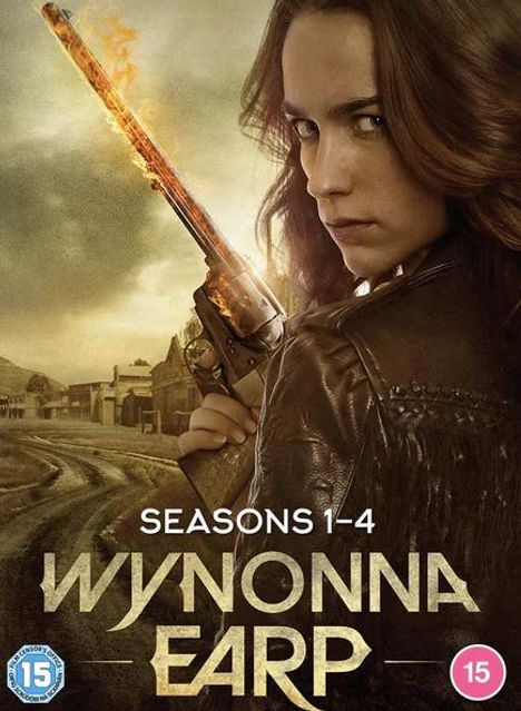 „Seasons 1-4 Wynonna Earp“. Frau mit Cowboyhut und glühendem Revolver vor einer staubigen Westernstadt.
