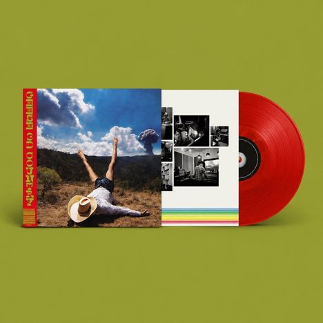 Ein rotes Vinyl mit einem Albumcover: Eine Person liegt rücklings in der Natur, die Beine in die Luft gestreckt.