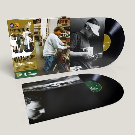 Text: "Endtroducing... DJ Shadow." Ein Album mit zwei Schallplatten. Cover zeigt einen Mann beim Durchstöbern von Platten.