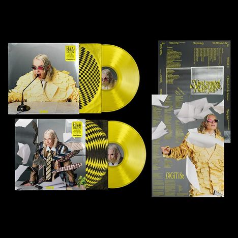 Zwei gelbe Schallplatten mit Hüllen. Cover zeigen Person in auffälligem Outfit mit Brille. Texte: „DIGITiSE“, „Humanize“.