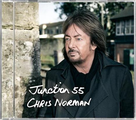 "Junction 55 Chris Norman" steht in weißer Schrift; ein Mann mit braunen Haaren und Bart trägt einen Mantel und schaut zur Seite.