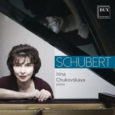 Schubert. Irina Chukovskaya, Piano. DUX-Logo. Frau lehnt am Flügel, ihr Spiegelbild ist sichtbar.
