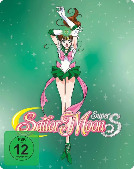 Text: "FSK ab 12 freigegeben", "Sailor Moon Super S". Illustration von Sailor Jupiter in grüner und rosa Uniform vor grünem Hintergrund.