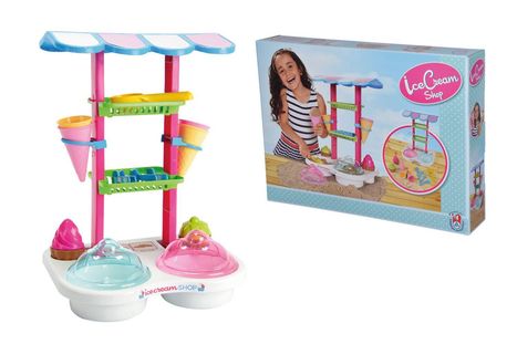„Ice Cream Shop“ steht auf einer Spielzeug-Eiscreme-Station mit pinken und blauen Elementen, daneben eine Verpackung.