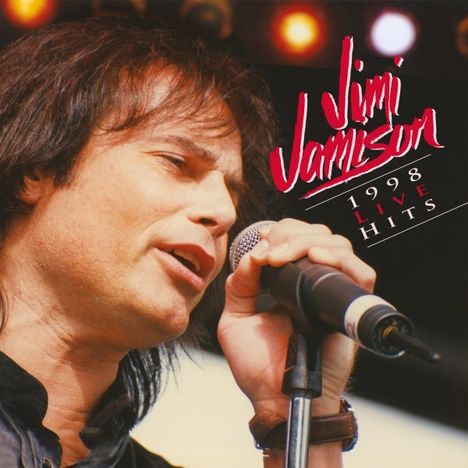 Der Text lautet: "Jimi Jamison, 1998 Live Hits". Ein Sänger hält ein Mikrofon auf einer Bühne.