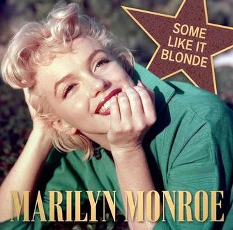 Text: "MARILYN MONROE", "SOME LIKE IT BLONDE". Frau mit hellblondem Haar, lächelnd, lehnt auf Händen. Sternsymbol oben rechts.