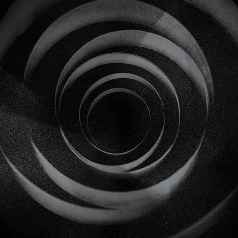 Spiralförmige, konzentrische Kreise in Grautönen, die in der Mitte ins Dunkle führen.