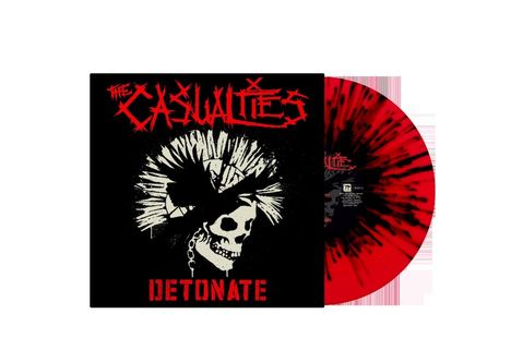 Text: "The Casualties", "Detonate". Eine rote Vinylplatte mit schwarzem, strahlenartigem Muster und ein Totenkopf mit Irokesenschnitt.