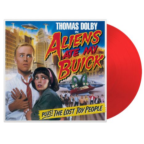 Text: "Thomas Dolby in Aliens Ate My Buick. Plus! The Lost Toy People." Illustration mit UFOs und Menschen in Panik.