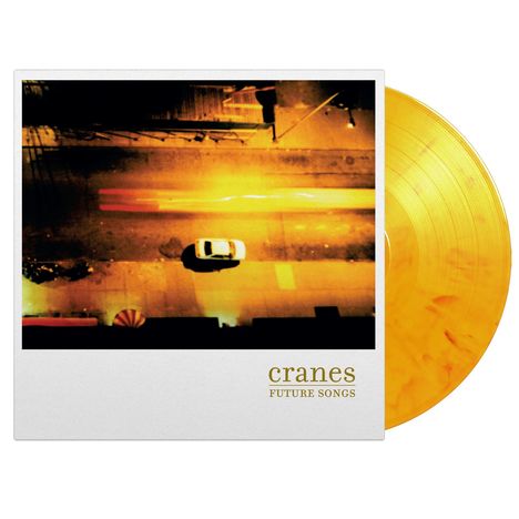 „cranes FUTURE SONGS“ in goldener Schrift. Eine Luftaufnahme einer Straße bei Nacht. Oranges Vinyl sichtbar auf der rechten Seite.