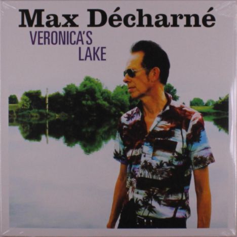 „Max Décharné Veronica's Lake“ in schwarzer und lila Schrift; ein Mann mit Sonnenbrille vor einer idyllischen Seelandschaft.