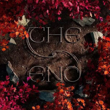 „The End“ steht auf erdigem Hintergrund, eingerahmt von roten und orangenen Blättern.