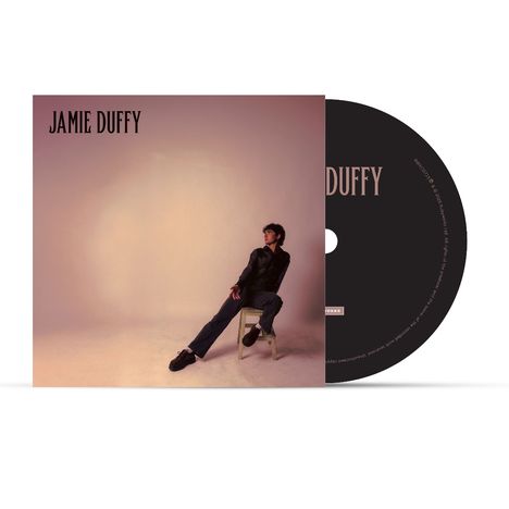 Text: "JAMIE DUFFY". CD-Cover mit stilisiertem Foto einer Person, die auf einem Stuhl lehnt. Dezente, warme Farbtöne.