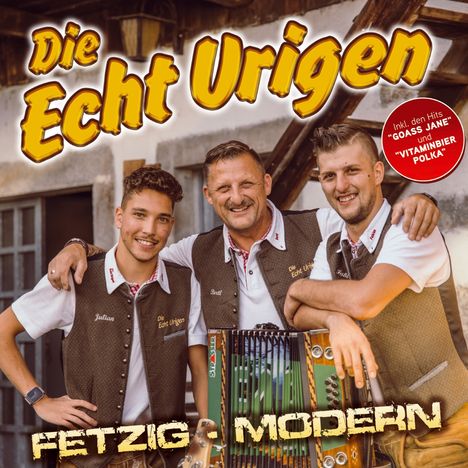 „Die Echt Urigen“ in gelber Schrift, „Fetzig - Modern“. Drei Männer mit Akkordeon, tragen Trachten, lächeln freundlich.